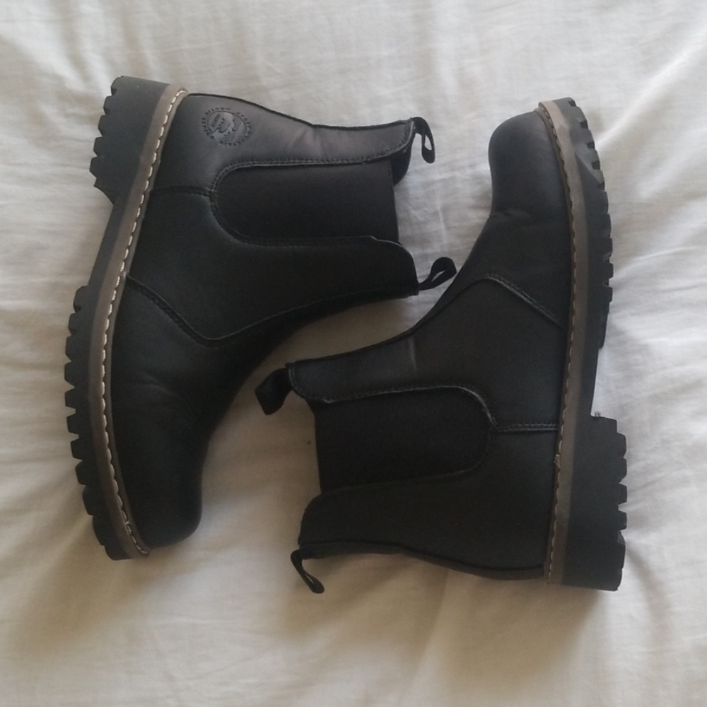 Women's black combat boots.